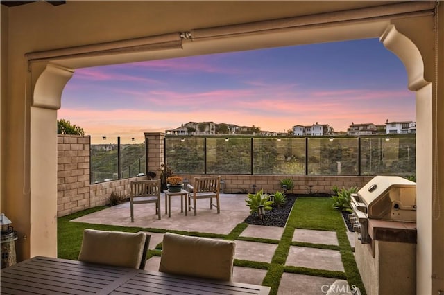 view of patio featuring grilling area and a fenced backyard