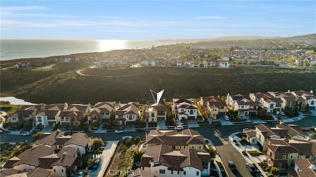 bird's eye view with a residential view and a water view