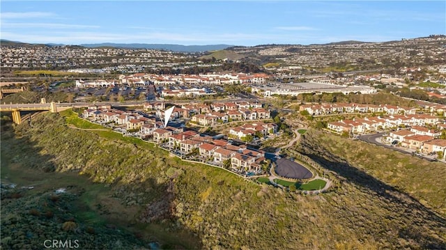 birds eye view of property featuring a mountain view and a residential view