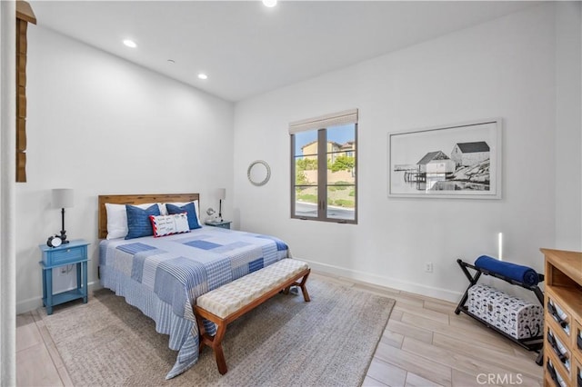 bedroom featuring recessed lighting, baseboards, and wood finished floors