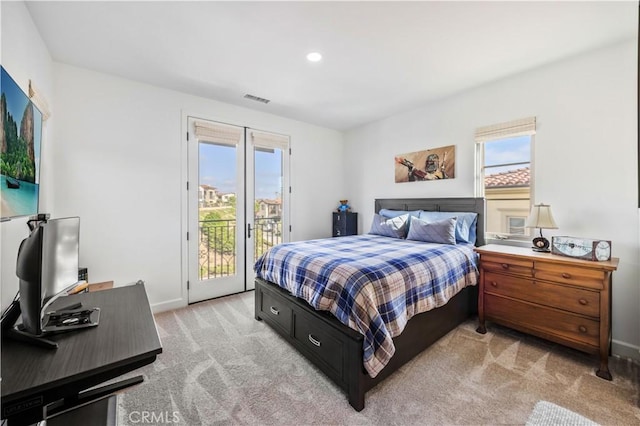 bedroom featuring visible vents, access to outside, multiple windows, and light colored carpet