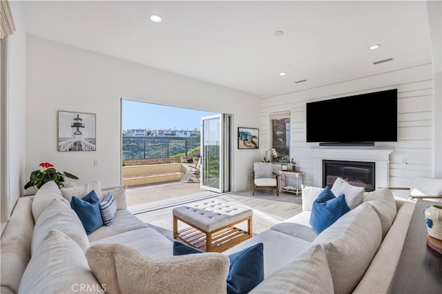 116 Via Bilbao, San Clemente, CA 92672 - living area with wood finished floors, recessed lighting, and a glass covered fireplace