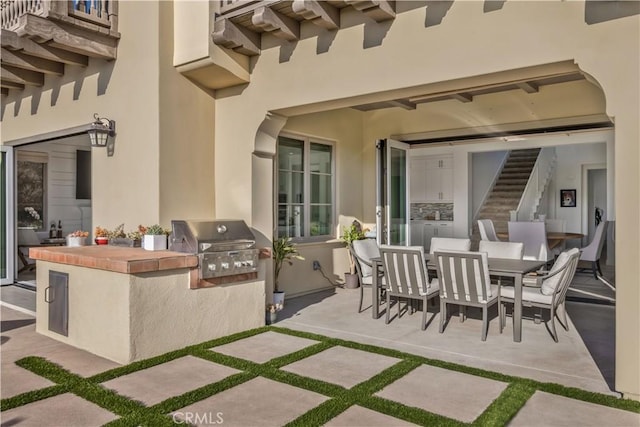 view of patio / terrace featuring outdoor dining space and area for grilling