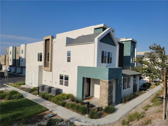 27078 Painted Sky Way, Valencia, CA 91381 - view of home's exterior with stucco siding and a cooling unit