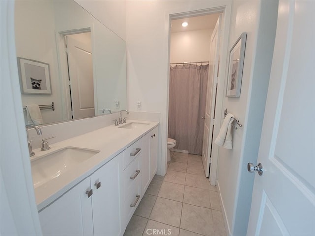 27078 Painted Sky Way, Valencia, CA 91381 - bathroom featuring toilet, tile patterned floors, double vanity, and a shower with curtain