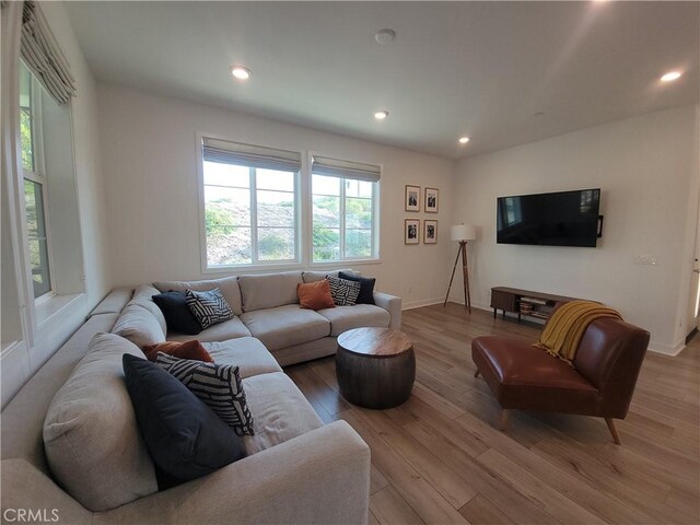 27078 Painted Sky Way, Valencia, CA 91381 - living area with wood finished floors, recessed lighting, and baseboards