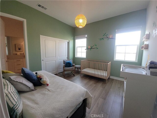 27078 Painted Sky Way, Valencia, CA 91381 - bedroom featuring light wood finished floors, a closet, and baseboards