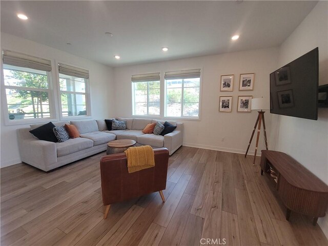 27078 Painted Sky Way, Valencia, CA 91381 - living room featuring wood finished floors, recessed lighting, and baseboards