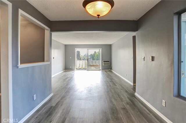 4343 Finley Ave Unit 35, Los Angeles, CA 90027 - spare room with wood finished floors and a wall unit AC