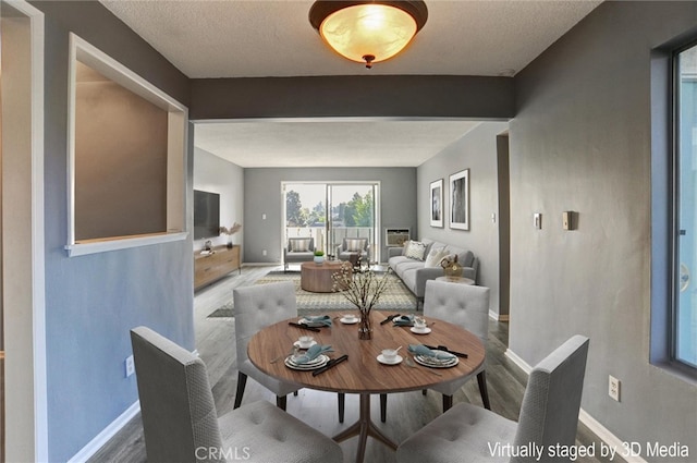 4343 Finley Ave Unit 35, Los Angeles, CA 90027 - dining area with baseboards and wood finished floors