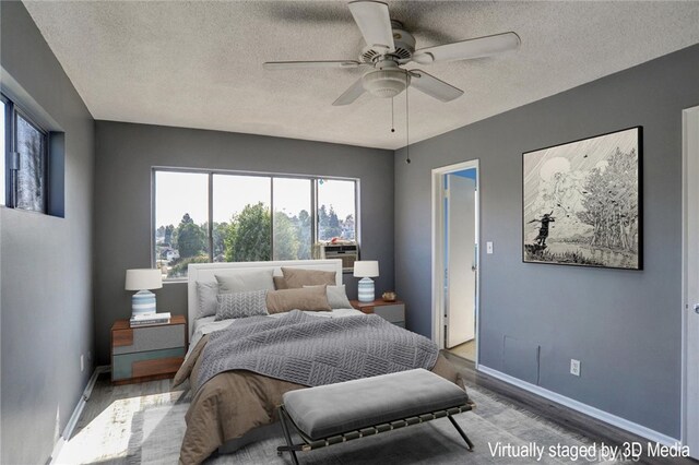 4343 Finley Ave Unit 35, Los Angeles, CA 90027 - bedroom with wood finished floors, a textured ceiling, and a ceiling fan