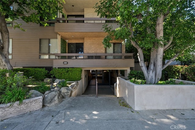view of property featuring driveway