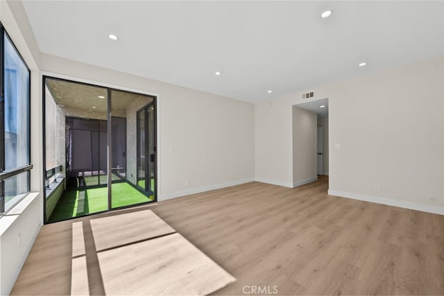 unfurnished room with recessed lighting, visible vents, baseboards, and light wood-style floors