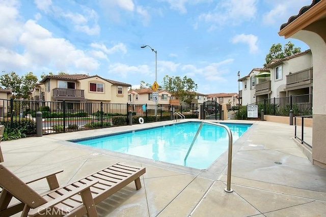 6008 Paseo Salinero, Carlsbad, CA 92009 - community pool featuring a patio area, fence, and a residential view