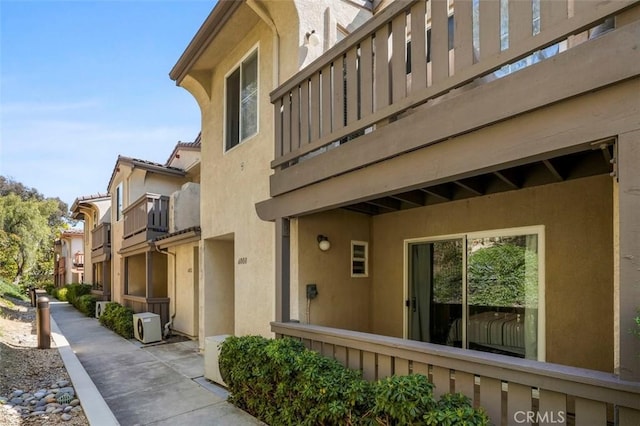6008 Paseo Salinero, Carlsbad, CA 92009 - view of home's exterior featuring ac unit, a balcony, and stucco siding