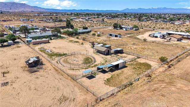 aerial view with a rural view, view of desert, and a mountain view