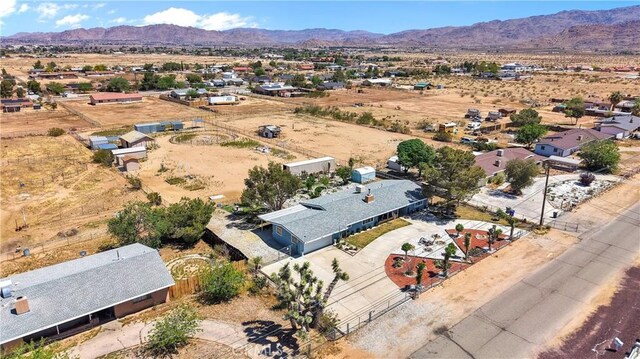 bird's eye view featuring a rural view, a desert view, and a mountain view