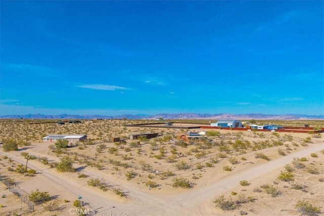 mountain view with a rural view and view of desert