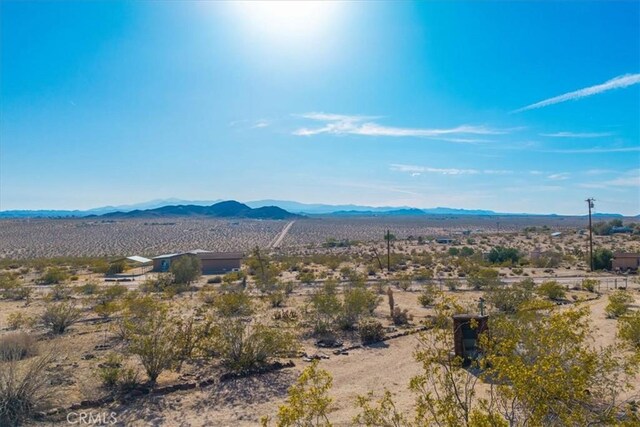 mountain view featuring a desert view and a rural view