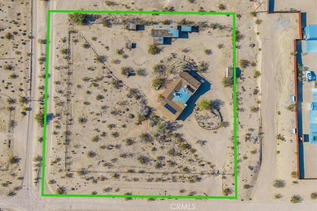 birds eye view of property with a rural view and view of desert