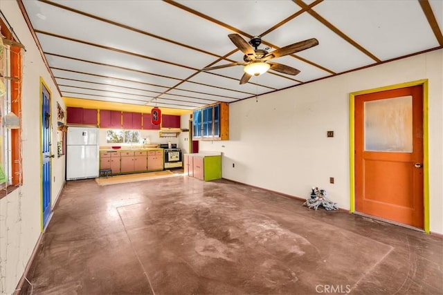 unfurnished living room featuring concrete flooring and a ceiling fan
