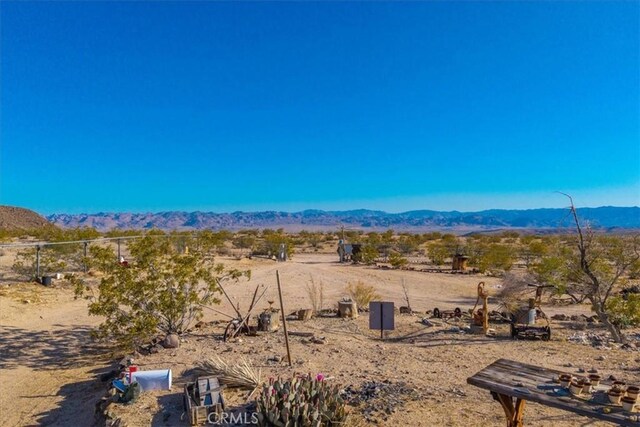 view of mountain feature featuring a rural view and a desert view