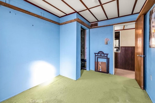 carpeted spare room with visible vents