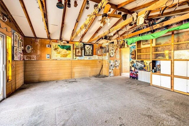 garage featuring wood walls
