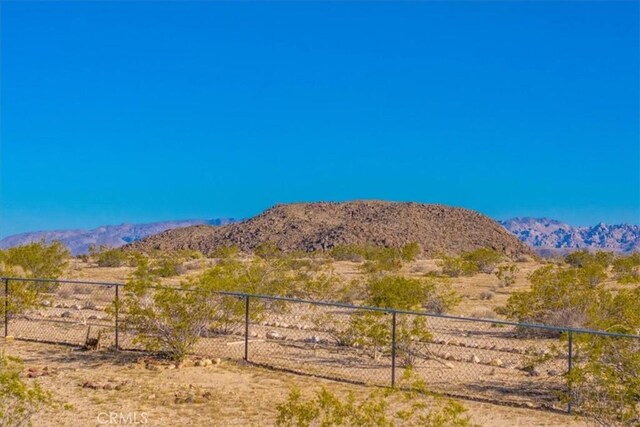 property view of mountains featuring a rural view