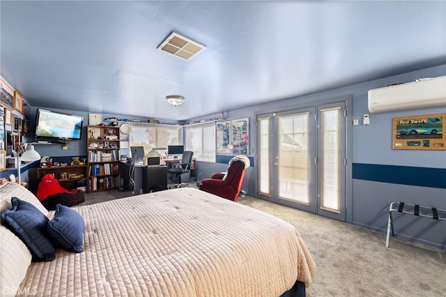 carpeted bedroom featuring visible vents, a wall mounted air conditioner, and access to outside