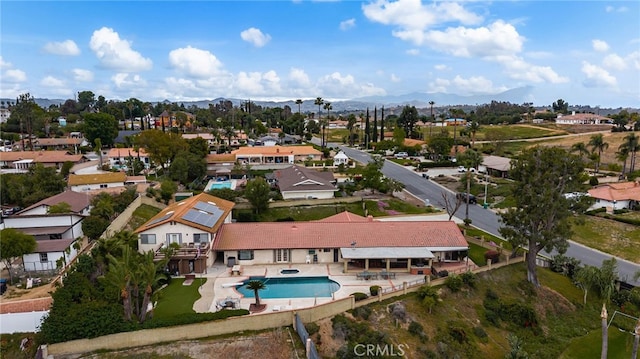 birds eye view of property featuring a mountain view and a residential view