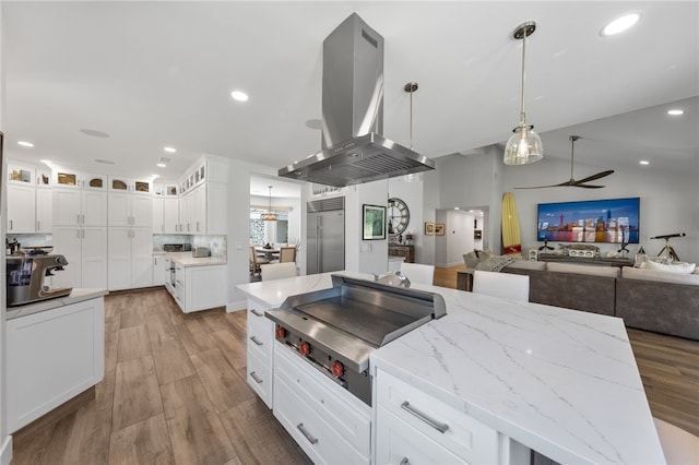 38101 Stone Meadow Dr, Murrieta, CA 92562 - kitchen featuring built in refrigerator, island exhaust hood, a ceiling fan, and wood finished floors