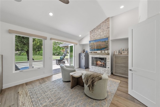38101 Stone Meadow Dr, Murrieta, CA 92562 - living room featuring recessed lighting, a ceiling fan, baseboards, a fireplace, and light wood-style flooring
