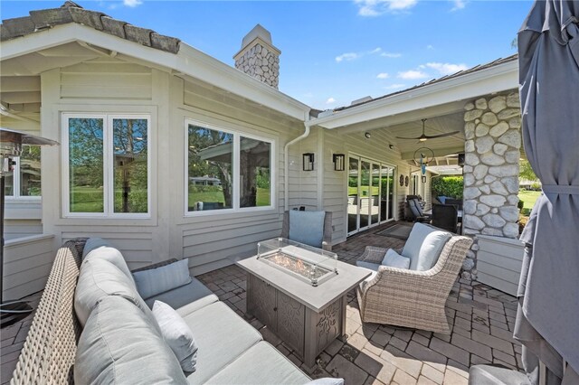 38101 Stone Meadow Dr, Murrieta, CA 92562 - view of patio / terrace with ceiling fan and an outdoor living space with a fire pit