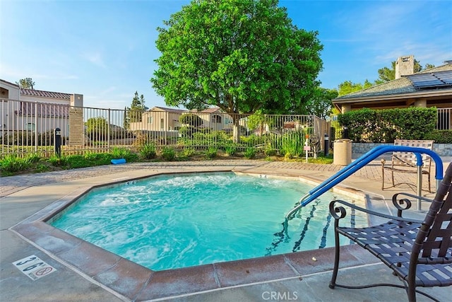 38101 Stone Meadow Dr, Murrieta, CA 92562 - view of swimming pool with fence, a swimming pool, and a patio