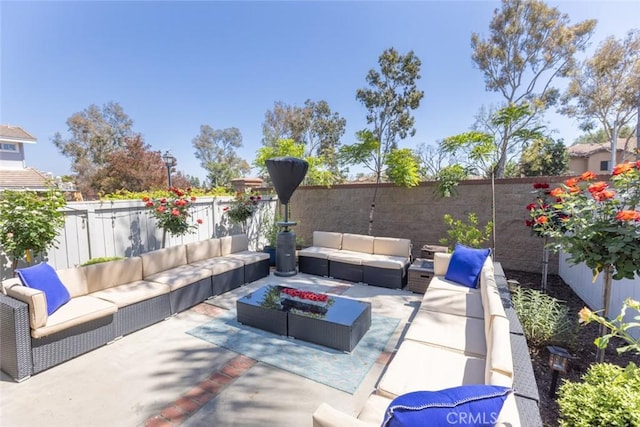 2196 Evergreen Dr, Tustin, CA 92782 - view of patio with an outdoor living space and a fenced backyard