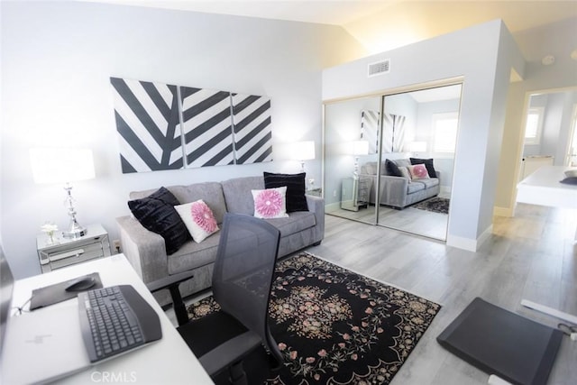 2196 Evergreen Dr, Tustin, CA 92782 - living room with lofted ceiling, wood finished floors, and baseboards