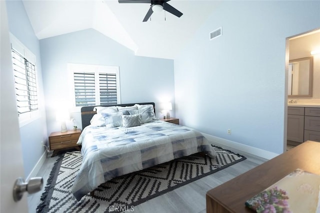 2196 Evergreen Dr, Tustin, CA 92782 - bedroom with lofted ceiling, baseboards, wood finished floors, ceiling fan, and ensuite bath