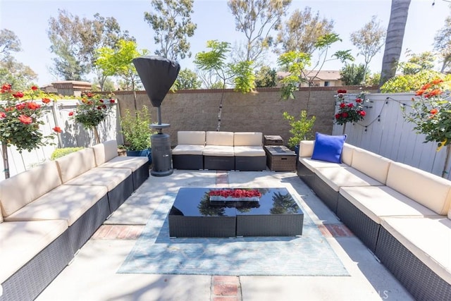 2196 Evergreen Dr, Tustin, CA 92782 - view of patio / terrace featuring an outdoor living space and a fenced backyard