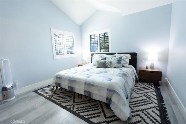 2196 Evergreen Dr, Tustin, CA 92782 - bedroom featuring wood finished floors, lofted ceiling, and baseboards
