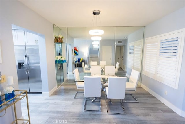 2196 Evergreen Dr, Tustin, CA 92782 - dining space with light wood-type flooring and baseboards