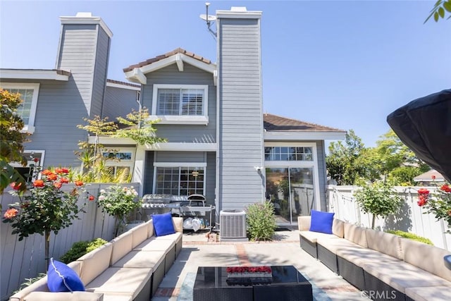 2196 Evergreen Dr, Tustin, CA 92782 - rear view of house featuring an outdoor hangout area, a chimney, fence, and central AC unit