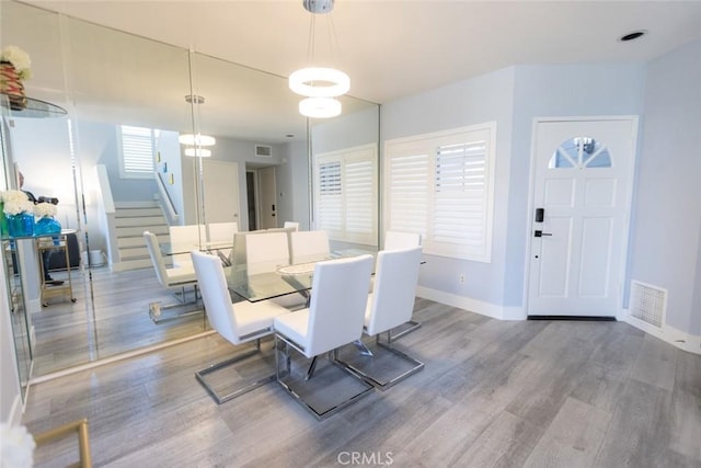 2196 Evergreen Dr, Tustin, CA 92782 - dining space with wood finished floors, stairs, and baseboards