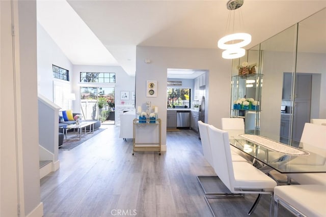 2196 Evergreen Dr, Tustin, CA 92782 - dining room featuring wood finished floors and a chandelier