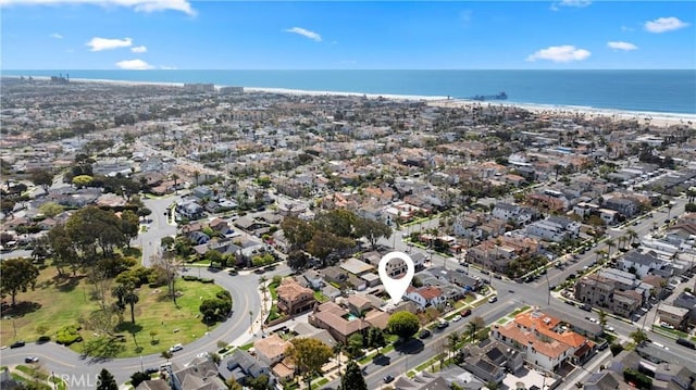 drone / aerial view with a water view and a residential view