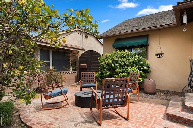view of patio / terrace with an outdoor fire pit