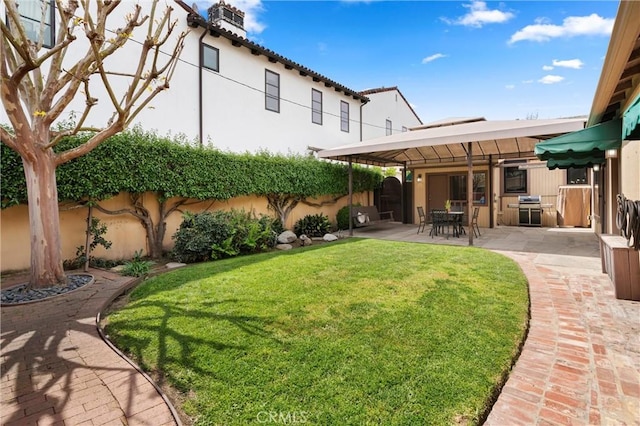 view of yard with fence and a patio area