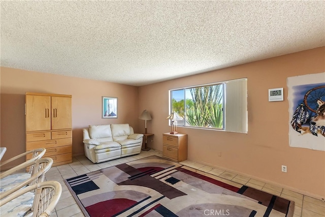 living room featuring a textured ceiling and light tile patterned floors