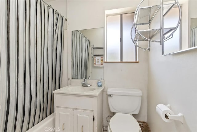 full bathroom featuring vanity, toilet, and shower / tub combo