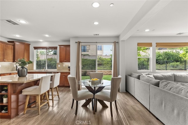 dining space with recessed lighting, visible vents, and light wood-style floors